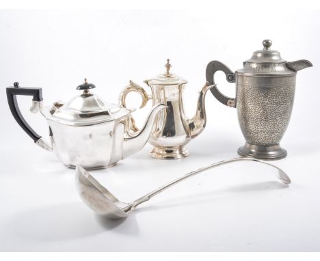 A pewter tray and four piece Roundhead pewter teaset, pewter tankards, two silver-plated teasets, fiddle pattern soup ladle.