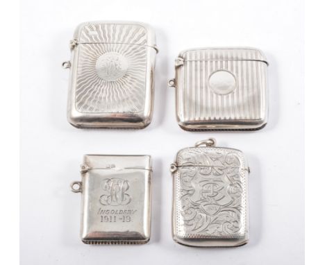 Four hallmarked silver vesta cases, various engine turned and  scroll engraved designs, the plain vesta having a personal ins
