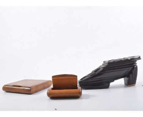 A collection of treen snuff boxes, a table snuff in the form of a carved shoe, 14cm long with a tulip motif to top and applie