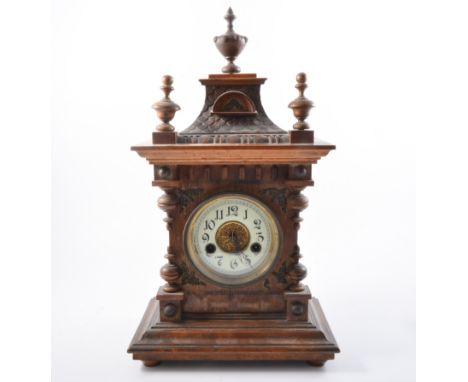 German shelf clock, carved fruitwood case, urn shaped finial, circular enamel dial with Arabic numerals, 14 day striking move