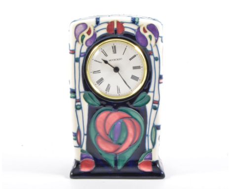 A Moorcroft mantel clock in the "Tribute to Charles Rennie Mackintosh" design by Rachel Bishop, 15.5cm high.