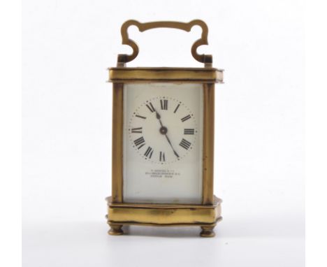 French brass cased carriage clock, serpentine outlines, white enamelled dial, signed V Samuel & Co., 65A Grace Church Street,