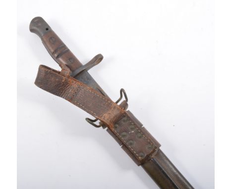 USA Remington bayonet, stamped 1917 in hardened leather scabbard, 58cm.