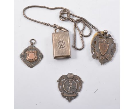 Pair of 9ct gold cufflinks, engine turned lozenge terminals; six early 20th century silver sporting award medals; and a silve