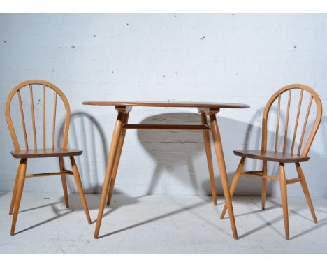 Ercol dining table, fixed oval top, spindle rack under-tier, W99cm x D89cm x H73cm, together with three low backed hoop dinin