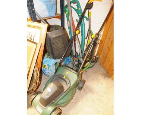 AN ELECTRIC LAWNMOWER TOGETHER WITH AN ELECTRIC BOSCH STRIMMER AND A SMALL COLLECTION OF GARDEN TOOLS