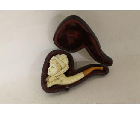 A CASED MEERSCHAUM PIPE WITH AMBER TIP