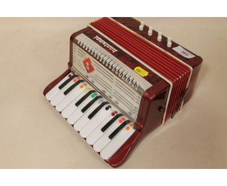 A SMALL NOVELTY BONTEMPI ACCORDION