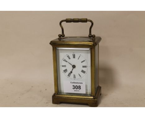 A SMALL CARRIAGE CLOCK