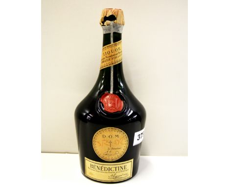 A bottle of vintage Benedictine liqueur.