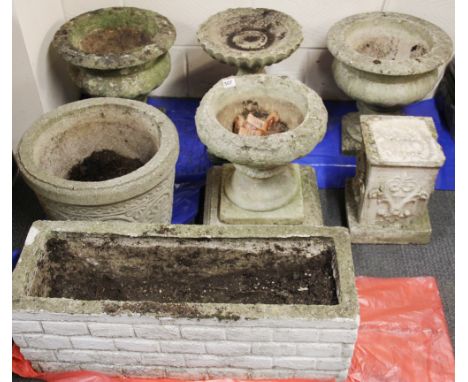 A group of vintage concrete garden planters and pedestals, the oblong planter is 76cm. others Dia. 40cm.