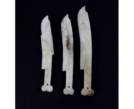 A group of three white jade blades used for skin cleaning in early Chinese steam baths, longest L. 16cms. Condition: good.