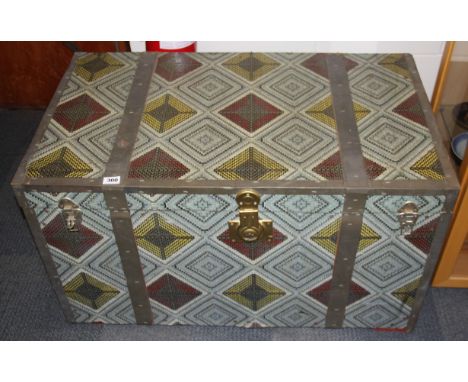 A large vintage metal and wood travelling trunk, 102 x 58 x 59cm.