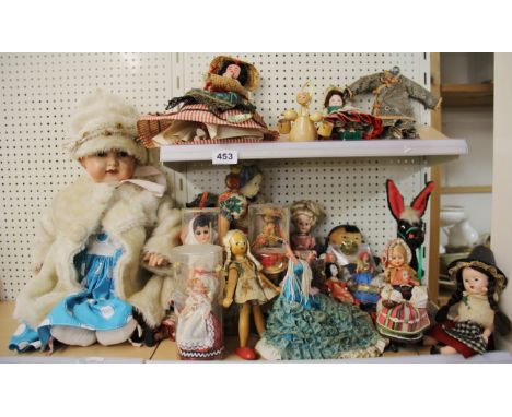 A collection of mixed vintage dolls.