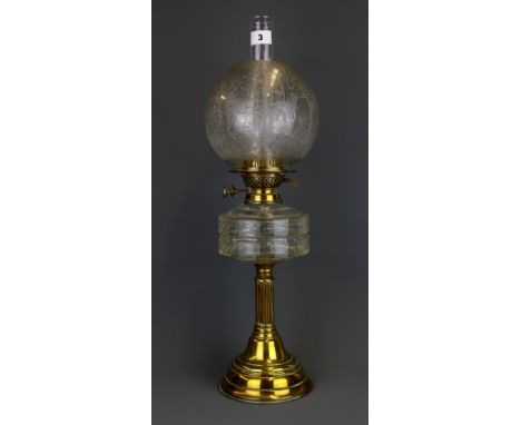 An Edwardian brass and glass oil lamp with frosted shade, H. 62cm.