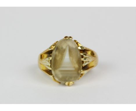 A very rare yellow metal, tested high carat gold, Burmese ring inset with clear and banded banded agate naturally forming a p