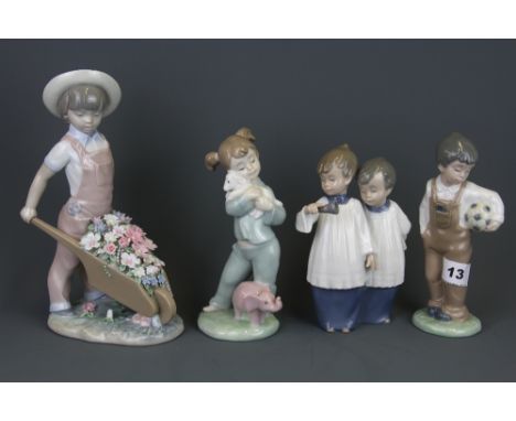 A Lladro porcelain figure of a child with a wheelbarrow filled with flowers and three further Nao porcelain figures of childr