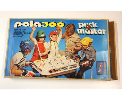 A boxed vintage Pola 300 Puck Master table game.