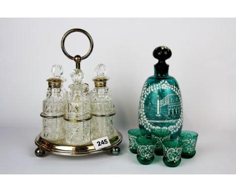 A silver plate and cut glass six bottle cruet together with a Venetian liquor decanter and five glasses.