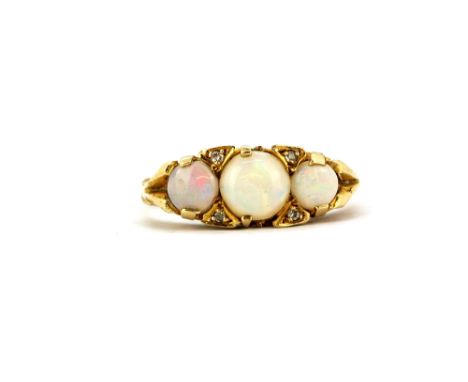 An antique 9ct yellow gold (worn hallmark) opal and diamond set ring, (M).