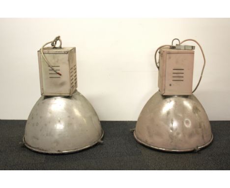 A pair of vintage industrial ceiling lights from the Laker Airlines hanger at Southend airport, Dia. 42cm, H. 57cm.
