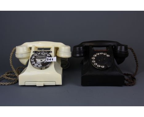 Two vintage Bakelite telephones.