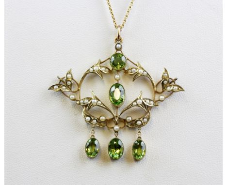 An Edwardian 9ct yellow gold (stamped 9ct) peridot and seed pearl set pendant and chain, L. 5 x 5.5cm.