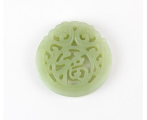 A Chinese carved nephrite jade double dragon amulet, Dia. 5.5cm.