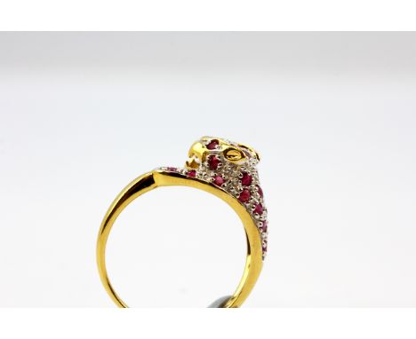 A 925 silver gilt ruby and diamond set panther shaped ring, (P).