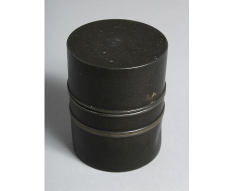 A CHINESE CYLINDRICAL METAL TEA CADDY, the base with impressed mark. 10cm high