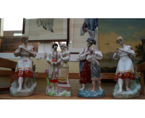 A group of four Russian porcelain figures, largest 29.5cm high. 