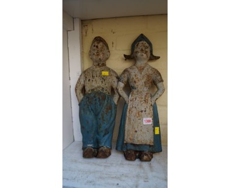 A pair of painted metal figures of Dutch children, 48cm high. 