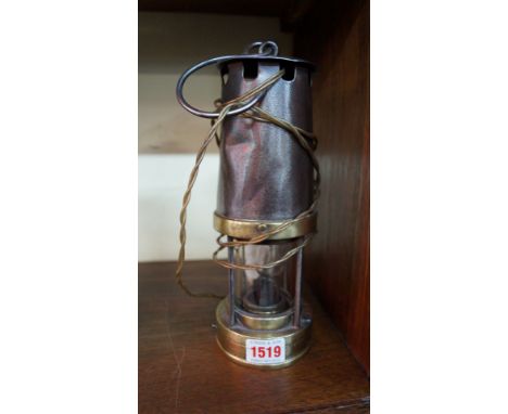 A Patterson & Co brass and steel miner's type lamp, converted for electricity, 26cm high. 