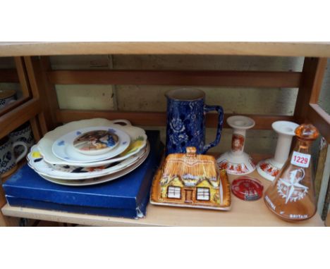 A mixed lot of ceramics, to include a Festival of Britain bottle and stopper; and a pair of Poole Fleurie pattern candlestick