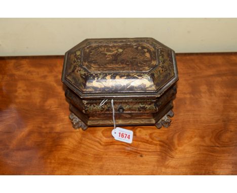 An early 19th century Anglo-Chinese gilt lacquered tea caddy, of bombe sarcophagus form, the interior with two pewter lidded 