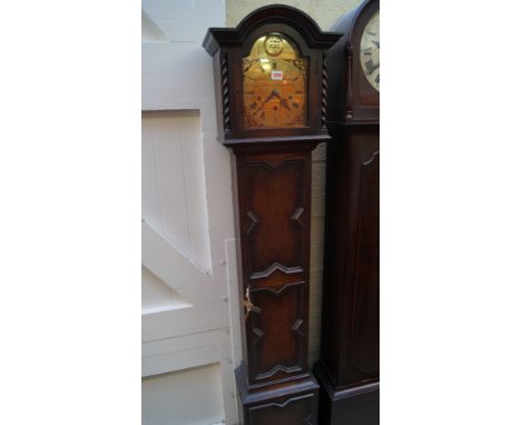 A 1920s oak small longcase clock, with Westminster chime and brass arched dial, 171.5cm high.