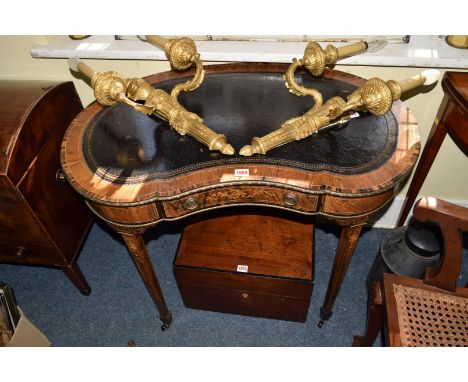 A good late 19th century rosewood, coromandel crossbanded and inlaid kidney shaped writing desk, with a gilt tooled leather i
