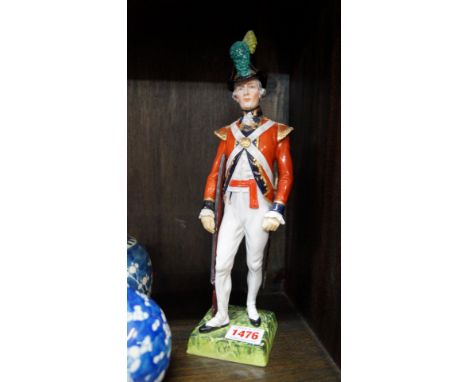 A mixed lot, to include: a pair of Poole pottery vases, (rim chip to one); a Dresden figure of a soldier; a treen shoe snuff 