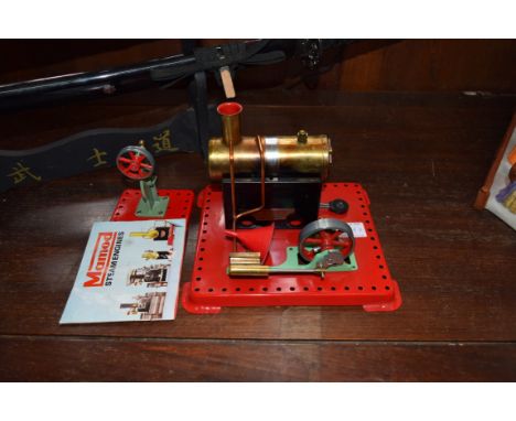 A Mamod stationary steam engine; together with power press; and leaflet.