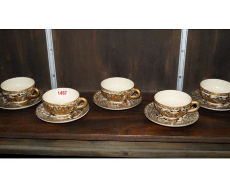 A set of five Japanese cups and saucers, signed Hododa, Meiji period.