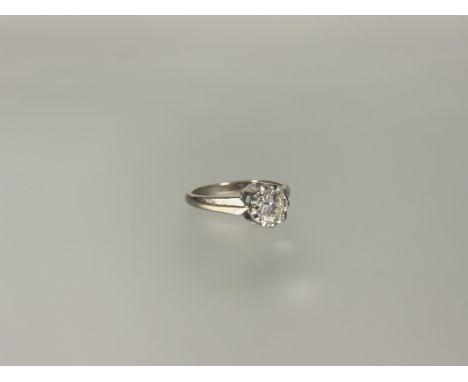 A single stone diamond ring,&nbsp;the round brilliant-cut stone weighing approx. 1ct, claw-set on a tapering 18ct white gold 
