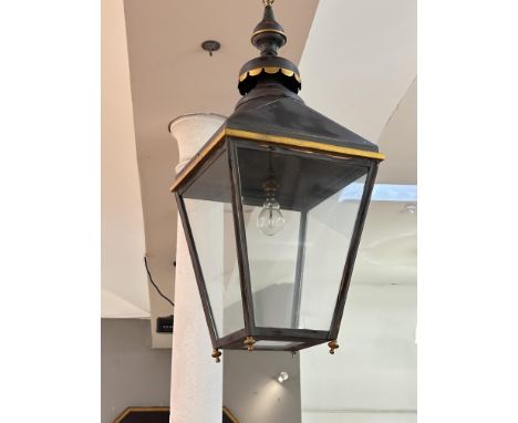 A parcel-gilt black tole hanging hall lantern, in period style, of tapering four-sided form, with brass suspension chain. Hei