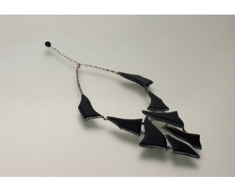Stefano Poletti (Italian, Contemporary), a Murano glass and white metal necklace of Modernist design, formed of eight black g