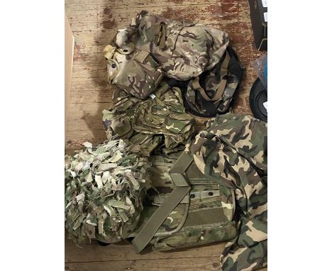 A helmet and military camouflage accessories including back pack etc 