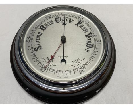 A vintage mahogany cased barometer 