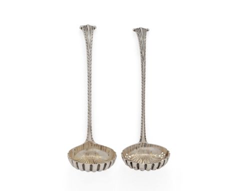 A Victorian silver sifter and sauce ladle. John Aldwinckle & Thomas Slater, London, 1891 & 1892. Both with scalloped bowls to