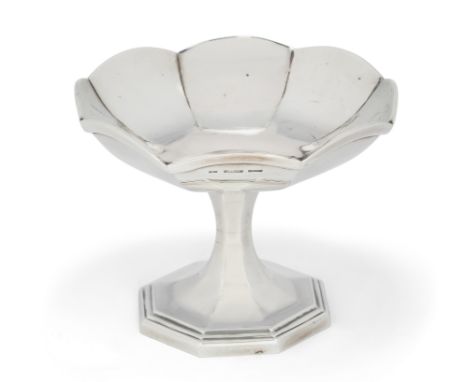 A 20th century silver tazza dish. Stamped C&K, Sterling silver. Probably Indian. Raised on a stepped and spreading octagonal 