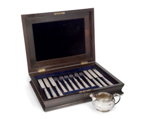 A boxed set of Victorian silver fruit knives and forks. Henry Wilkinson & Co., Sheffield, 1855-1862. The set comprising twelv