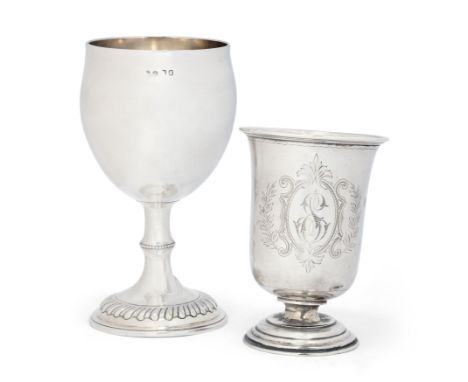 A George III silver wine goblet. London, c.1818, Marks rubbed. The plain body to a stem with beaded knop spreading to a lobed