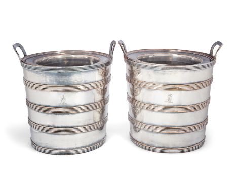 A pair of Georgian Old Sheffield Plate barrel-shaped wine coolers. c.1810. Designed with reeded banding to cylindrical bodies